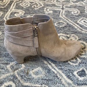pair of size 7 tan booties with a two inch heel